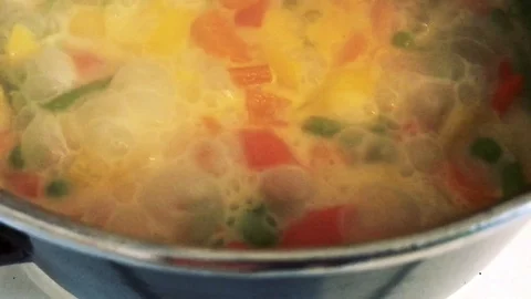 Cooking vegetable soup in pot Stock Footage 120138007
