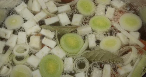 Cooking a vegetable stock closeup selective focus Stock Footage 157385633