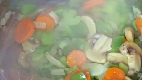 Cooking: Vegetables being stirred Video stock 278348076