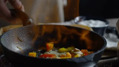 Cooking Vegetables with Flambé Stock Footage 112329426