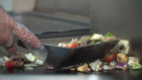 Cooking Vegetables on flat top grill Video stock 90861825