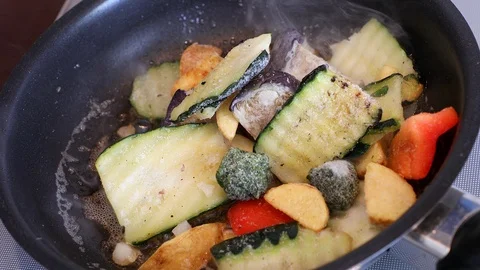 Cooking vegetables in a frying pan Stock Footage 95986796