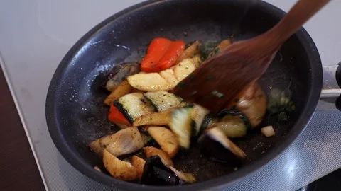 Cooking vegetables in a frying pan Stock Footage 95989352