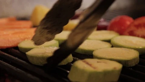 Cooking vegetables on the grill. The chef prepares grilled vegetables.close up Vídeo Stock 90084975