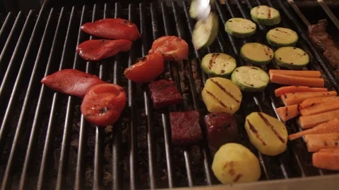 Cooking vegetables on the grill. The chef prepares grilled vegetables.close up 動画素材 90085081