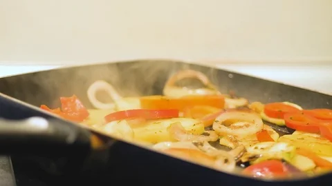Cooking vegetables in a grilled pan Stock Footage 99828544