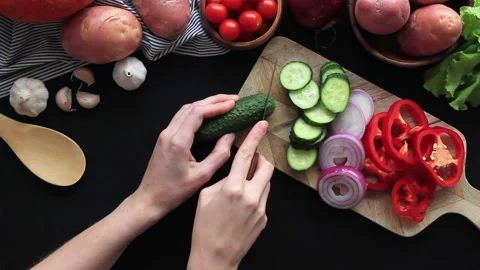 Cooking vegetables on a kitchen table. Hands cutting red pepper Stock Footage 133205217
