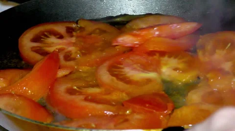 Cooking of vegetables. Mixing of tomato sleces Stock Footage 68659322