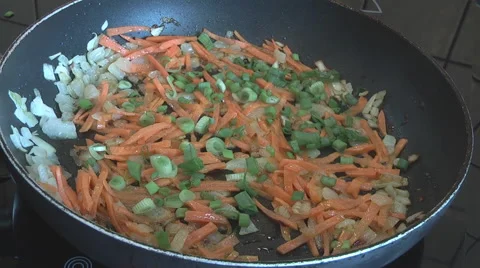 Cooking vegetables in a pan Stock Footage 49824973