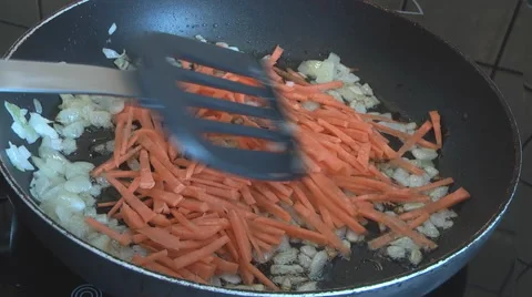 Cooking vegetables in a pan Stock Footage 49825254