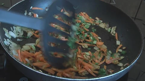 Cooking vegetables in a pan Stock Footage 49825574