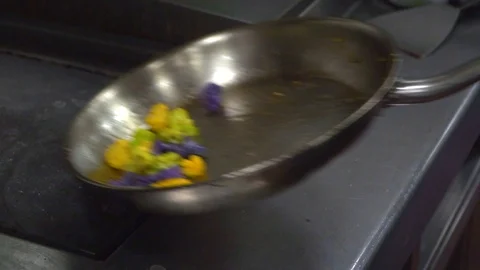 Cooking vegetables in a pan Stock Footage 86579337