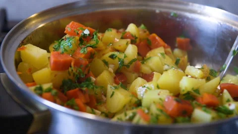 Cooking vegetables in a pan.  Stock Footage 164171659