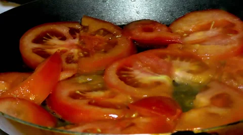 Cooking of vegetables. Roasting tomatoes Stock Footage 68659334