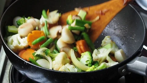 Cooking vegetables in slow motion Stock Footage