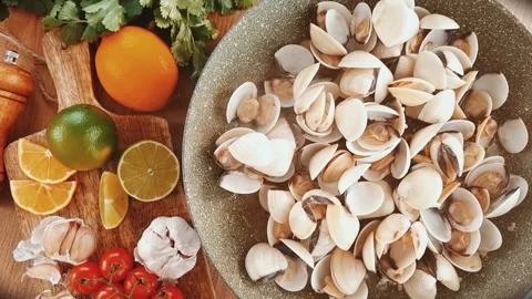 Cooking vongole shellfish, in a frying pan, with spices and white wine, mobile Stock Footage 317345768
