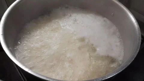 Cooking white Basmati rice video footage Stock Footage 333543890