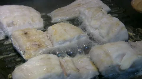 Cooking white fish Stock Footage 10772954