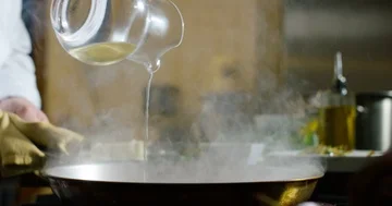 Cooking with white wine 4k Stock Footage 85836077