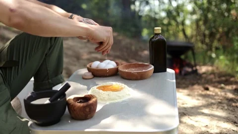 Cooking in the Wild: Adding Salt to Fresh Dough Stock-Footage 280120961