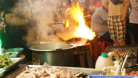 Cooking with wok Stock Footage 104971288