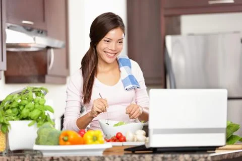 Cooking woman using computer Stock Photos