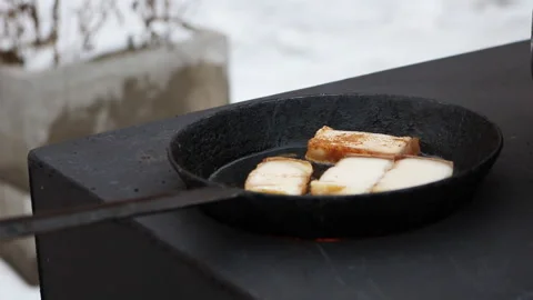 Cooking on a wood stove. Stock Footage 202301072