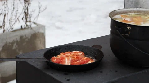 Cooking on a wood stove. Stock Footage 202301095