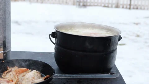 Cooking on a wood stove. Stock Footage 202301129