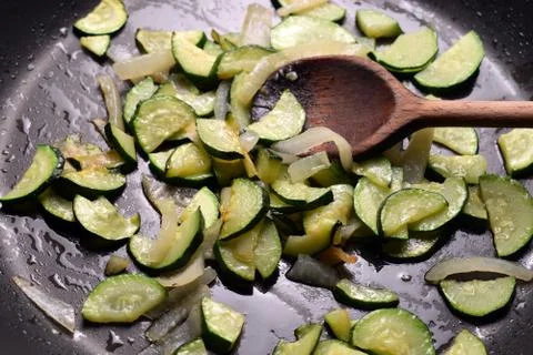 Cooking zucchini with onion Stock Photos