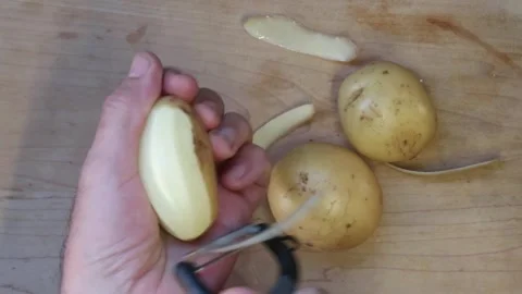 Cooking:Peeling potatoes Stock Footage 278348164