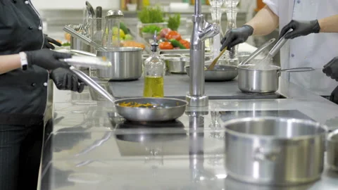 Cooks cut vegetables in the kitchen in a restaurant Video stock 145528569