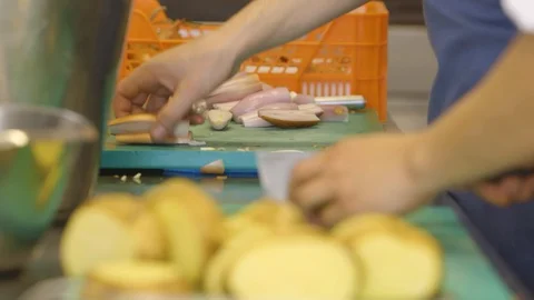 Cooks Cutting Potato Video stock 127036472