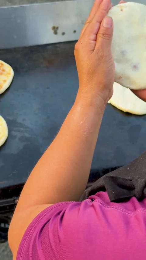 Cook's Hand in Motion While Preparing Pupusas Stock-Footage 323876111
