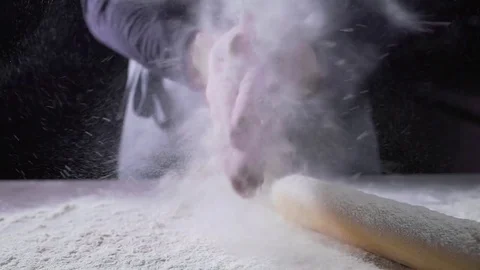 The cook's hands in flour, baker at work, bread and bakery, flour at the kitchen Stock Footage