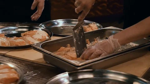 Cooks hands spread fish on plates Stock Footage 110904273