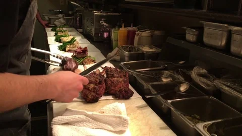 Cooks in Kitchen with High End Food Vidéo 82213541