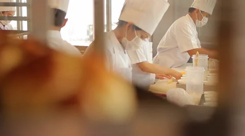 Cooks Making Bakery in Professional Kitchen Stock Footage 62421222
