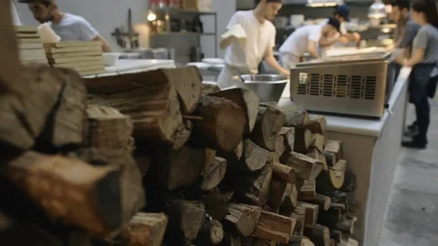Cooks or chefs team preparing pizzas. Kitchen in pizzeria Stock Footage 106722464