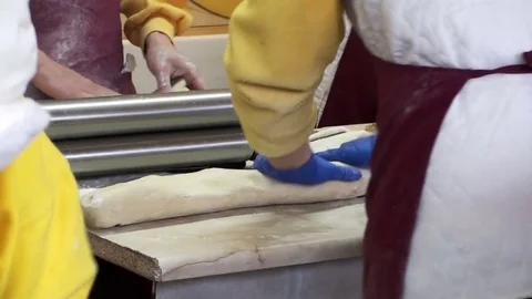 Cooks prepare dough in the kitchen of the restaurant. Stock Footage 75806995