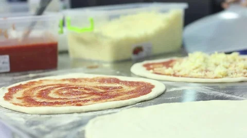 Cooks prepare pizza Stock Footage 73425734
