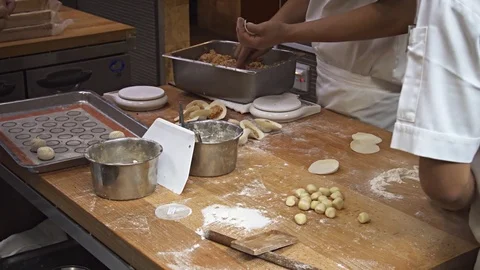 Cooks at Work in a Singapore Restaurant. Video 4k UltraHD Stock Footage