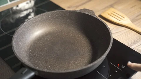 Cooktop panel. Cooking. Preparing the stove for cooking. Kitchen. Daylight Stock Footage 129537746