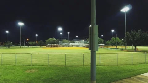 Cool Aerial evening shot of LED light at baseball field Stock Footage 68999612