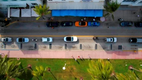 Cool Aerial shot over line of cars driving through Ocean Drive in South Beach Stock Footage 96236027
