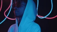 Cool African American Man In Sunglasses And Hoodie Dancing In Neon Light Stock Footage