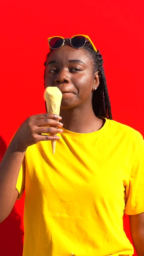Cool african woman licking an ice cream Stock Video Pond5