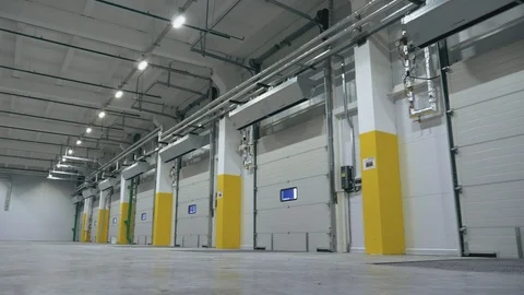 Cool angle view of the automatic gate inside the empty logistics center Stock Footage 104250770