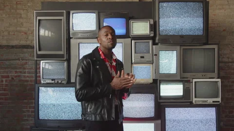 Cool Artist Stands In Front Of Static Televisions Stock-Footage 270329371