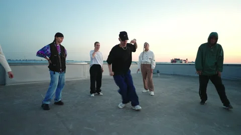 Cool b-boy is dancing hip-hop style in breakdance battle and friendly party on Видео 209203248
